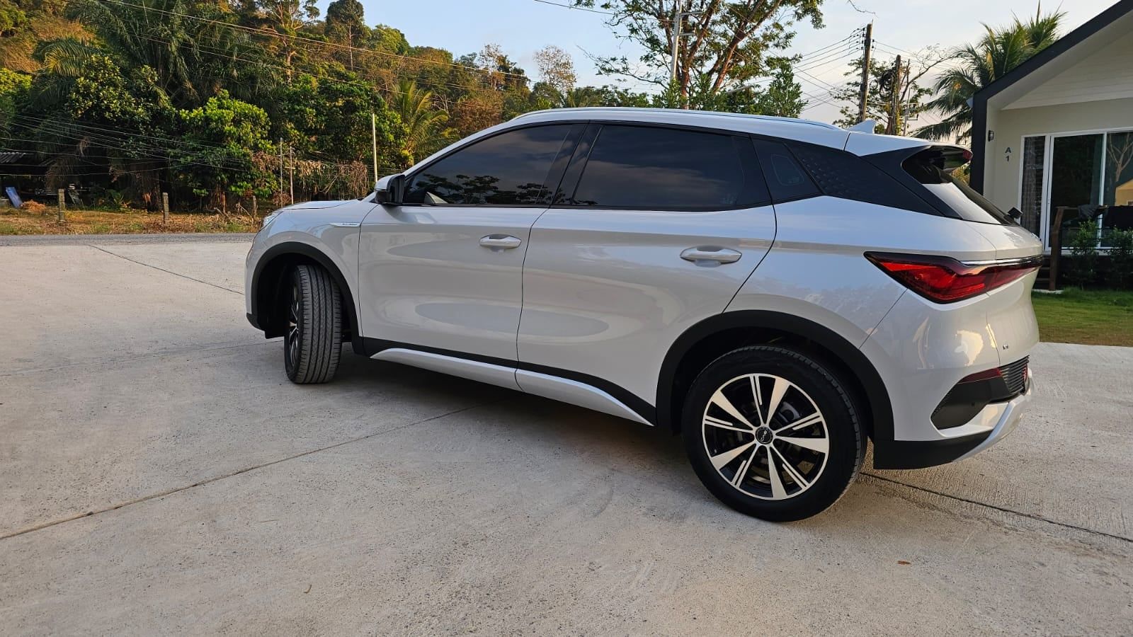 BYD Atto 3 2023, white — rear three-quarter view